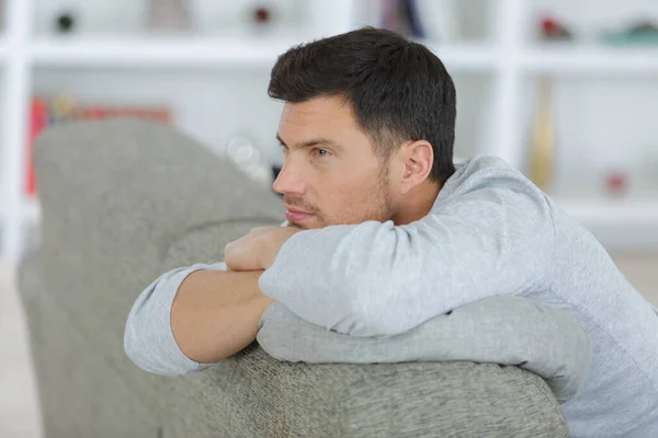 Man Leaning Back Sofa — Stockfoto