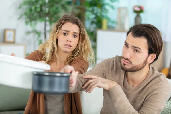 Desperate Couple Worried Home Leaks Living Room — Stockfoto