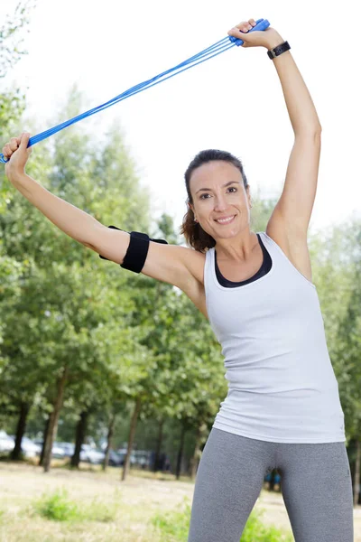 Sporty Woman Stretching Her Arm Park — Fotografia de Stock