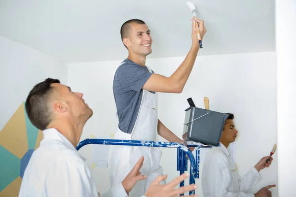 Commercial Painting Apprentice Painting Ceiling — Zdjęcie stockowe