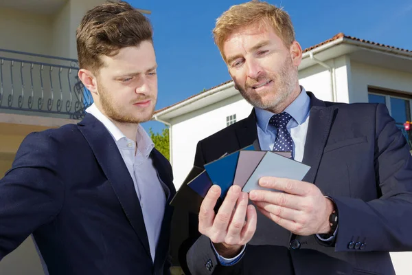 Designer Showing Colour Swatches Businessman — Stockfoto