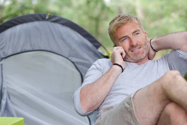 Man Talking Telephone Sat Front His Tent — Fotografia de Stock