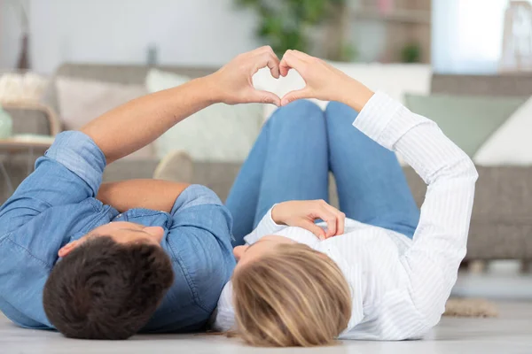 Couple Making Heart Shape Hands Home — Φωτογραφία Αρχείου