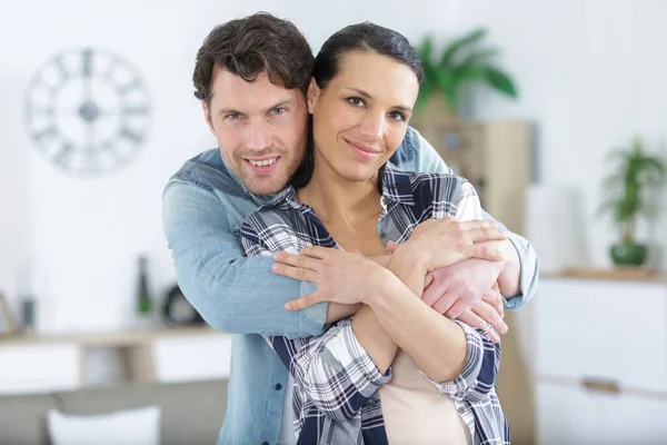 Happy Couple Embracing New Home — Stock Photo, Image