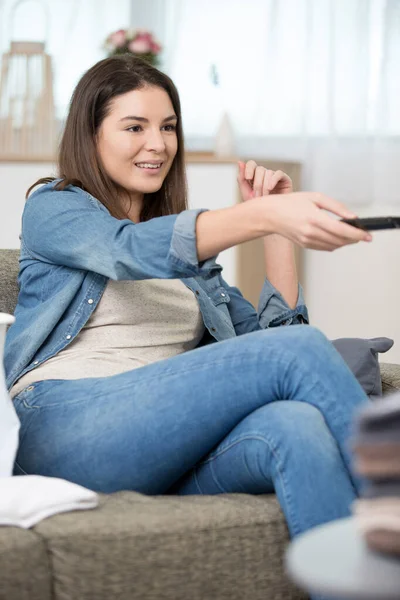 Young Girl Sitting Sofa Using Remote — Stock Photo, Image