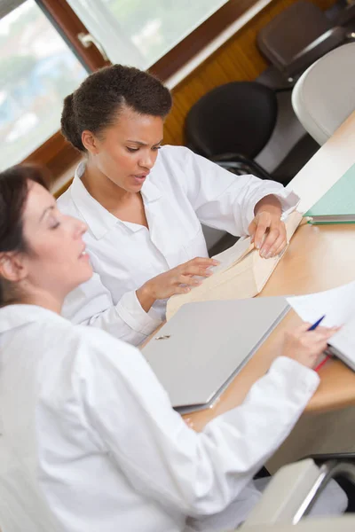 Women White Jackets Studying Desk — Stock Photo, Image