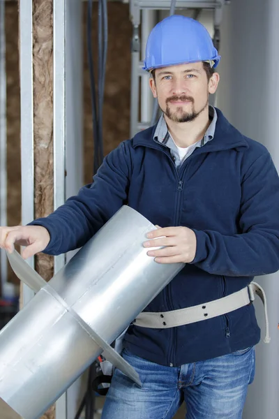 Construction Worker Site Holding Pipe — Stock Photo, Image