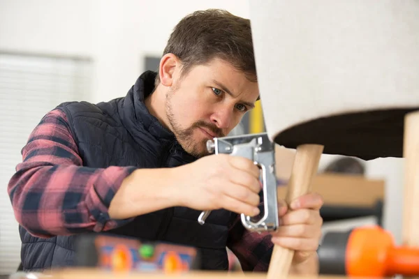 Upholsterer Using Staple Gun — Stock Photo, Image