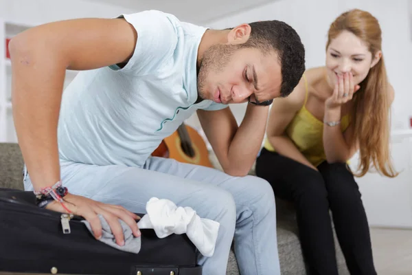 Man Figuring Out How Zip His Suitcase — Stock Photo, Image