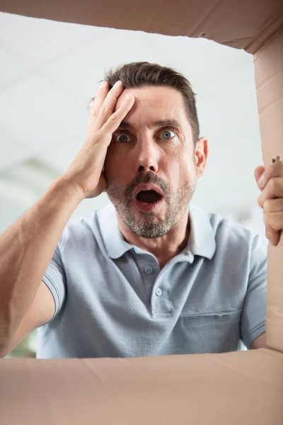 Shocked Guy Looking Empty Cardboard Box — Stock Photo, Image