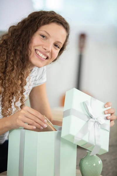 Picture Showing Woman Opening Present — Stock Photo, Image