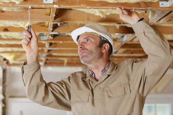Male Construction Worker Using Screwdriver Ceiling Joist — Stock Photo, Image