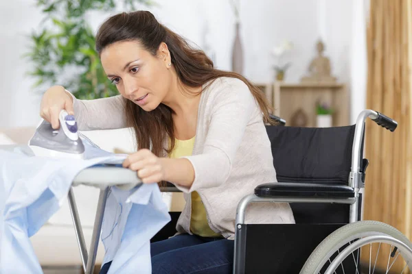 Disabled Young Woman Ironing Clothes — Stock Photo, Image