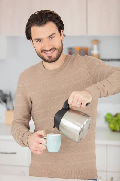 Young Elegant Man Pouring Tea Cup — Stock Photo, Image