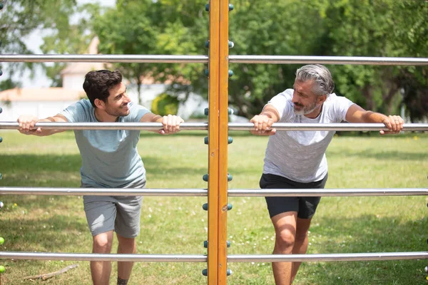 Two Strong Motivated Men Doing Dips Exercises — Stock Photo, Image