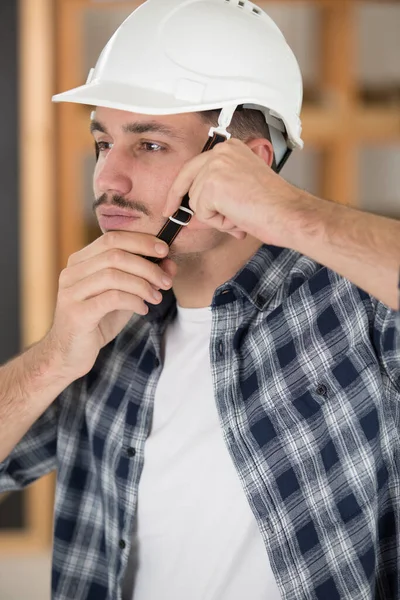 Man Adjusting Chin Strap His Safety Helmet — Stock Photo, Image