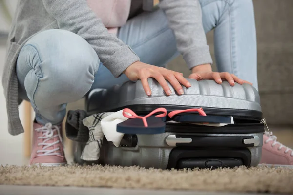 Woman Struggling Pack Suitcase — Stock Photo, Image