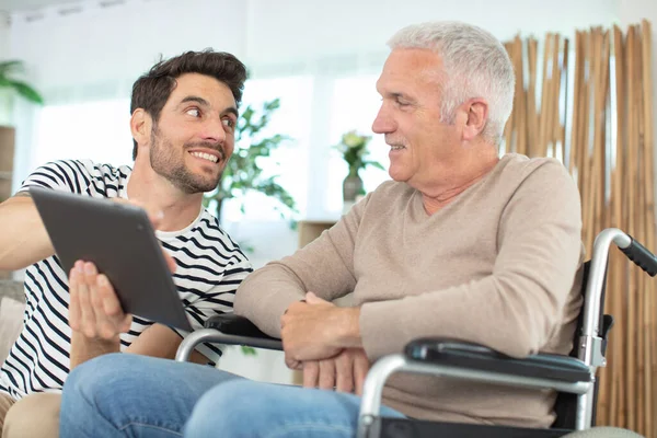 Cheerful Disabled Retired Man Sitting Wheelchair Bearded Son — Stock Photo, Image