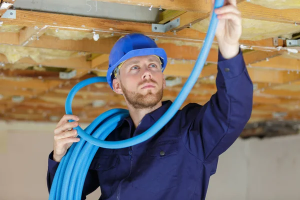 Plumber Checking Ceiling Pipes — Stock Photo, Image