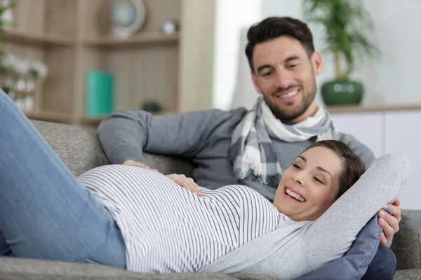 Pregnant Woman Handsome Man Lying Sofa Home — Stock Photo, Image