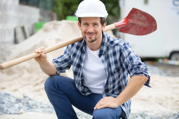 Cheerful Young Maintenance Workerholding Shovel — Stock Photo, Image