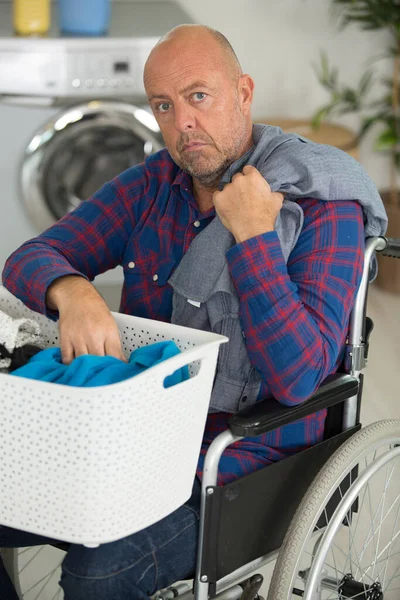 Upset Disabled Man Wheelchair Ironing Clothing — Stock Photo, Image