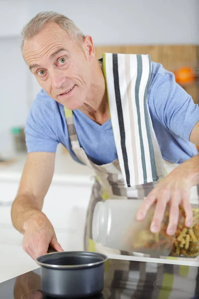 Mature Man Cooking Boiling Pasta — Stock Photo, Image