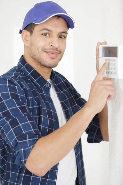 Male Electrician Installing Security System Door — Stock Photo, Image