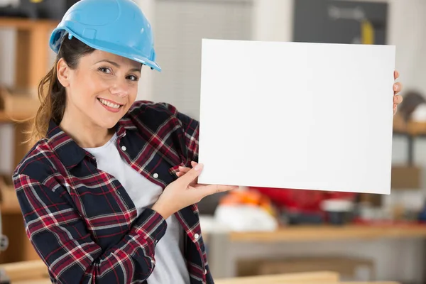 Woman Builder Holding White Banner — 스톡 사진