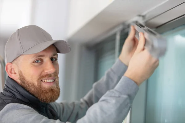 Handyman Installing Window Shutter — Stock Photo, Image