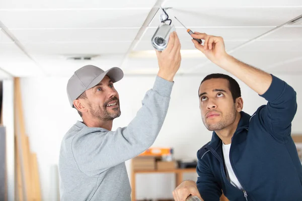 Technicians Installing Security Camera System Home — 스톡 사진