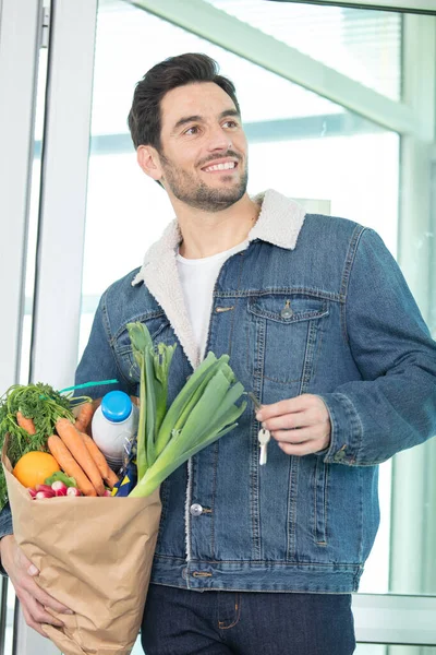 Young Man Coming Home Shopping Groceries — Stock Photo, Image