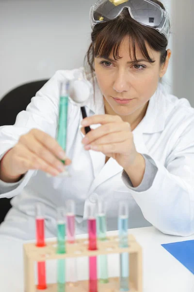 Woman Using Magnifying Glass Look Pipette — Stock Photo, Image