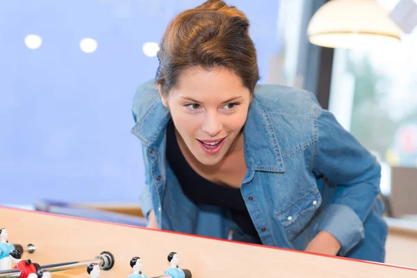 Attractive Young Woman Playing Table Football While Laughing Smiling — стоковое фото