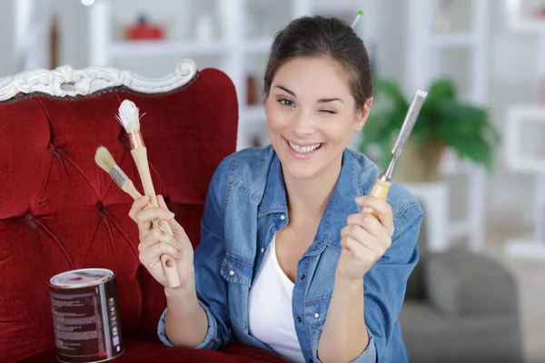 Woman Holding Craft Tools Winking Camera — Stock Photo, Image