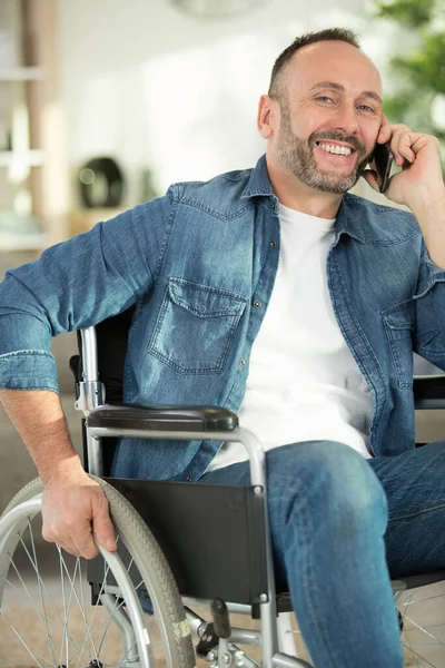 Man Wheelchair Talking Mobile Phone Home Office — Stock Photo, Image