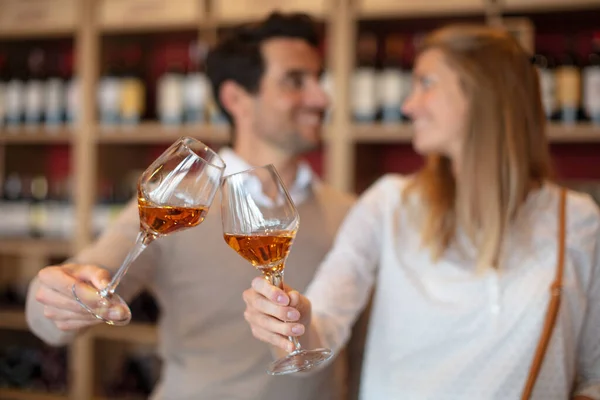 Couple Toasting Wineglasses Containing Cognac — Stok fotoğraf