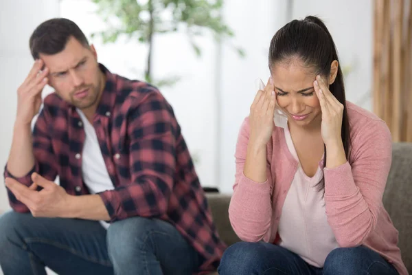 Photo Young Sad Couple Sitting Sofa —  Fotos de Stock