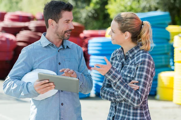 Man Woman Materials Yard Holding Tablet — ストック写真