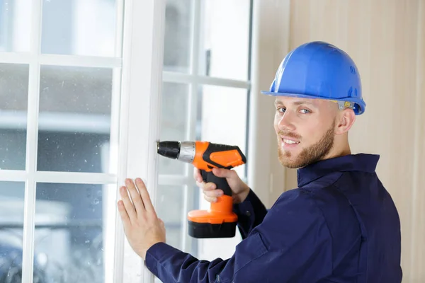 Contractor Using Cordless Drill Patio Door — Stockfoto