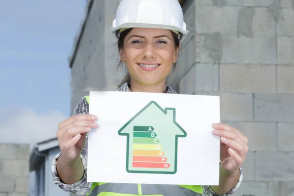 Beautiful Woman Engineer Holding Energy Graph — Stock Photo, Image