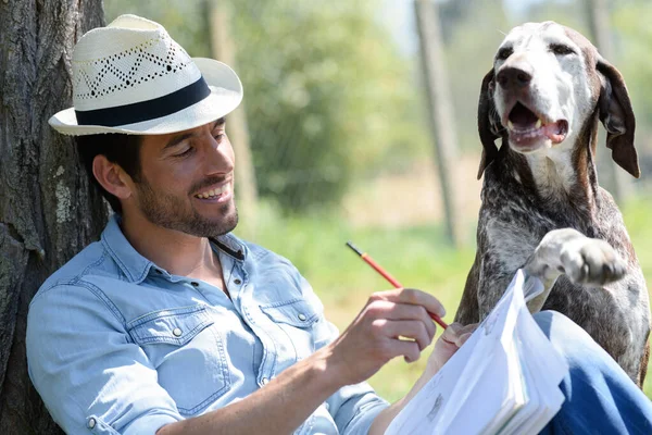 Male Artist Sketching Picture His Dog — Stockfoto