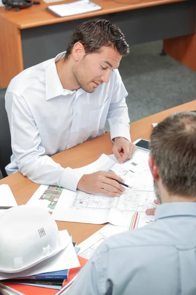 Architect Reviewing Plans Office — Fotografia de Stock