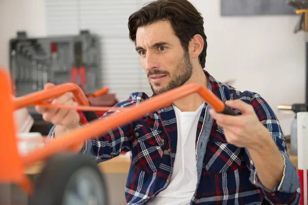 Technician Fixing Trolley Wheel — Stock Photo, Image