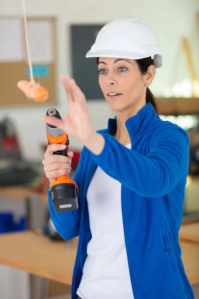 Female Builder Reaching Carrot Motivation Concept — Fotografia de Stock