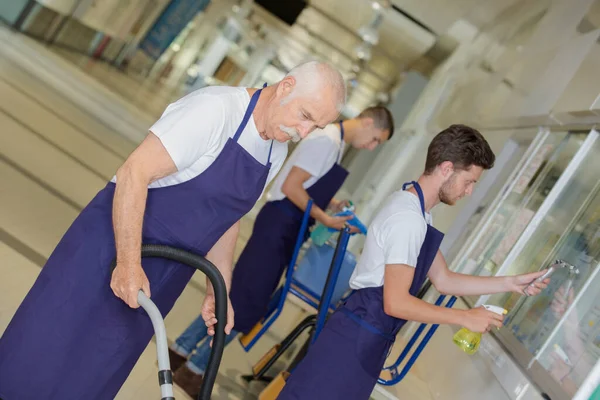 Male Janitors Cleaning Hallway — ストック写真
