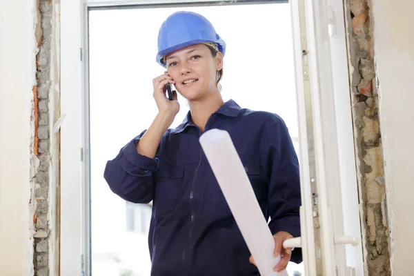 Smiling Builder Phone Looking Camera — Stockfoto