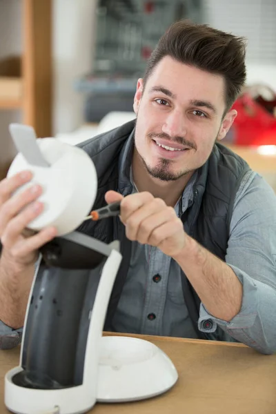 Professional Young Repairman Fixing Coffee Machine — Stok fotoğraf