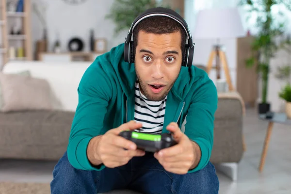 Expressive Male Gamer Sat Sofa — Stock Fotó