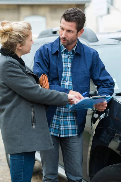 woman driver and angry man arguing about car damage